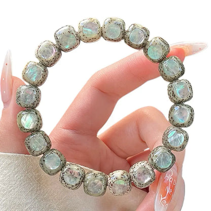 Aurora · Bodhi Seeds Fidget Bracelet · Abalone Shell Inlay